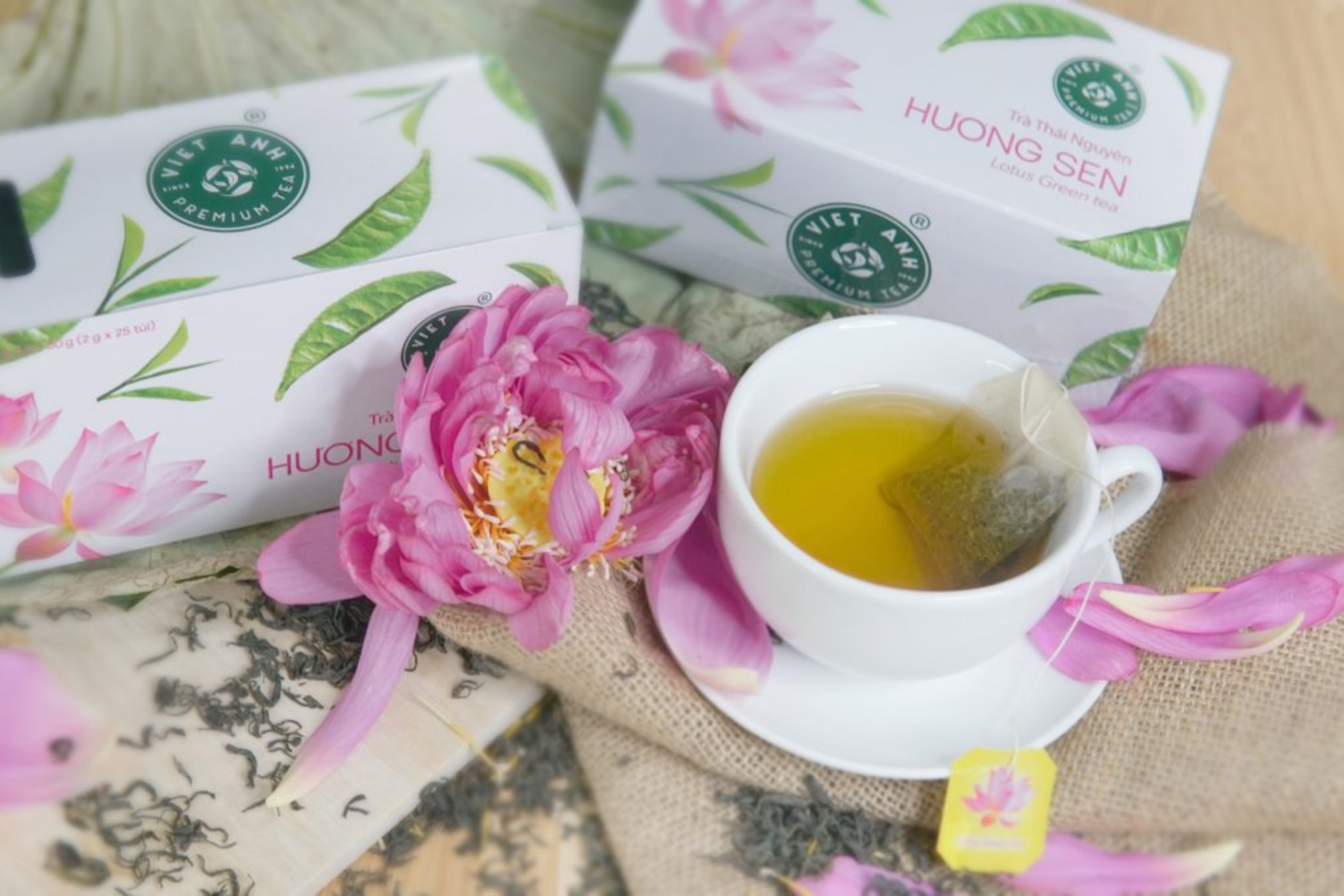 Premium Vietnamese lotus green tea pouches in elegant packaging for wedding favors.