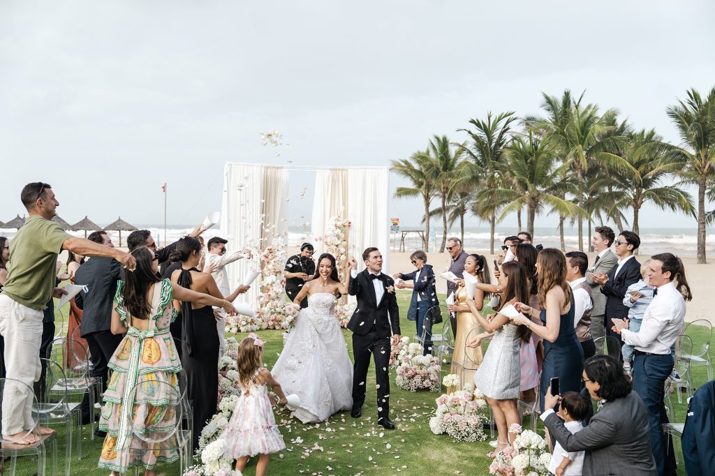 Petals in the air, cheers all around, and little Gia leading the way — the moment Queenie & Pablo walked back down the aisle as husband and wife.