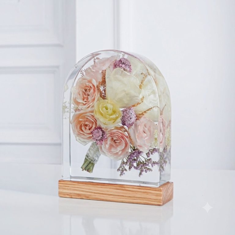 Preserved wedding bouquet in an arched resin dome with wooden base